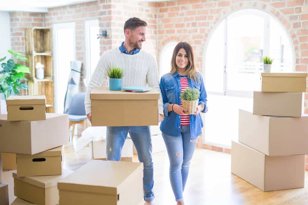 A young couple moving into their first home