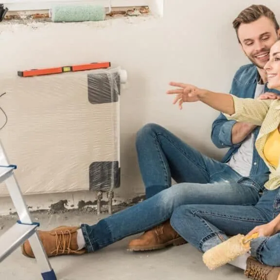how do construction loans work when you own the land